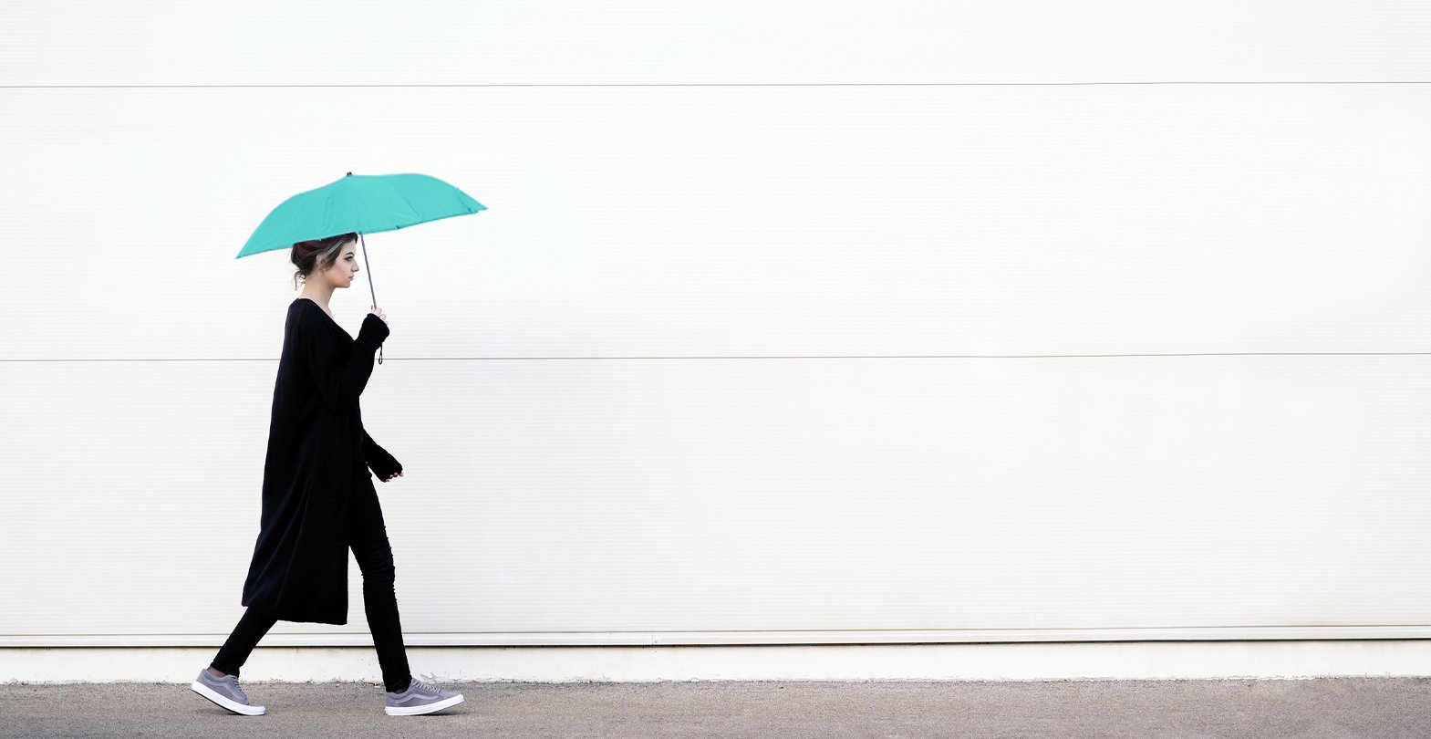 Young,Woman,In,Black,Clothes,Walking,With,Pink,Umbrella